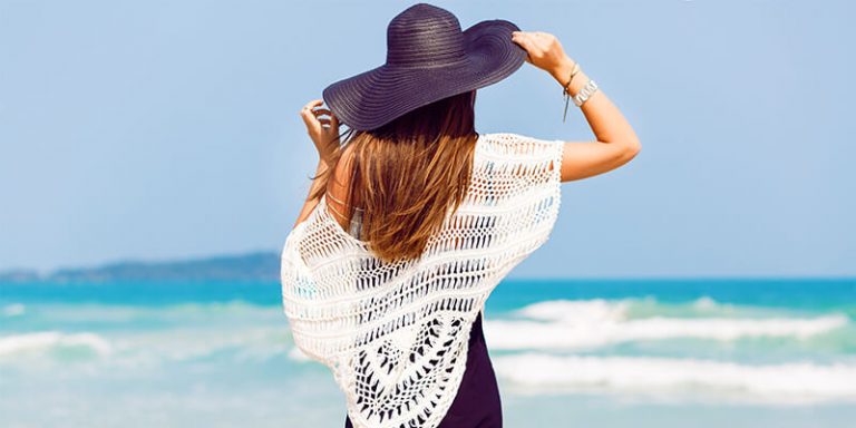 Young Woman Looking Over The Ocean