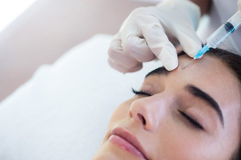 Woman Having Botox On Her Forehead