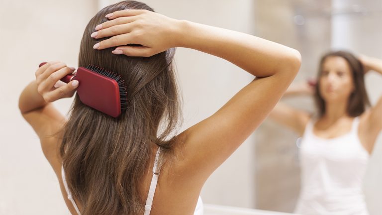 woman brushing hair