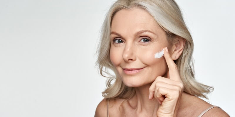 woman applying moisturiser