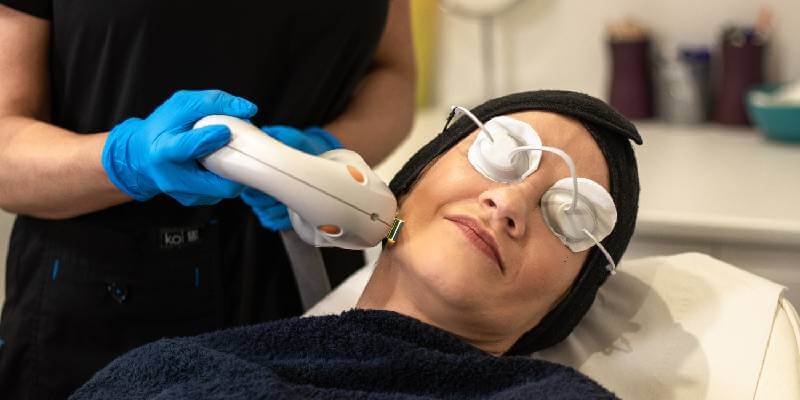 woman laying down having photorejuvenation