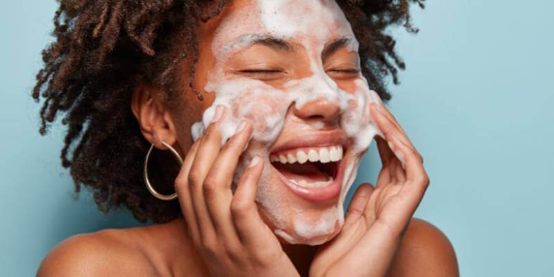 Woman cleaning face