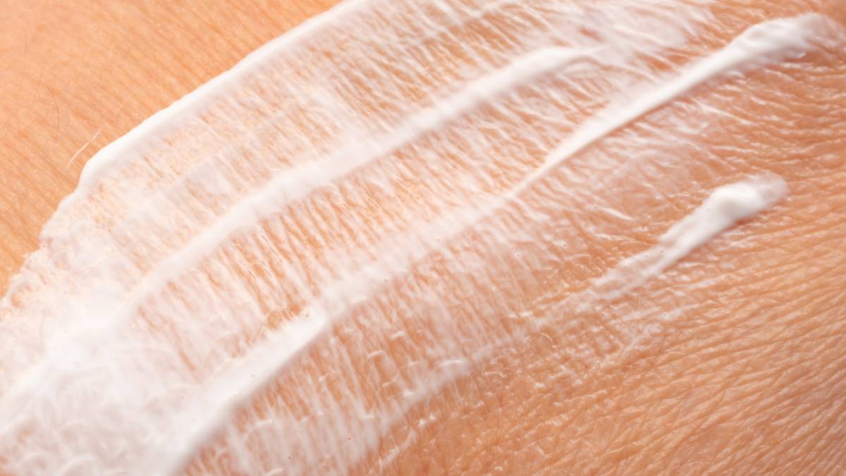 Woman caring for dry skin during the winter months
